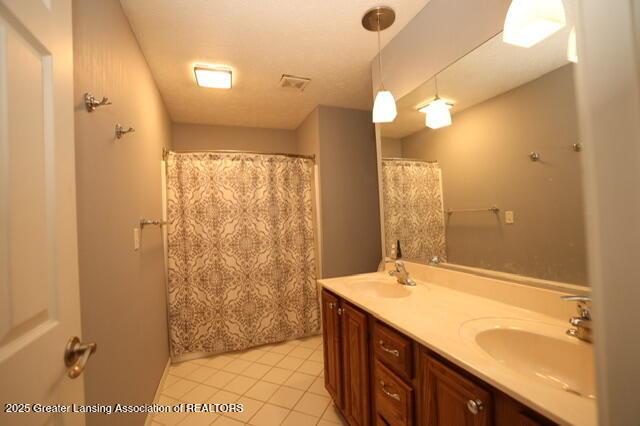 bathroom featuring vanity and tile patterned floors