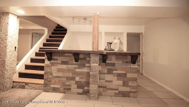 bar with tile patterned floors