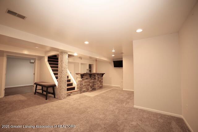 basement featuring carpet flooring