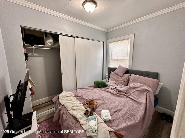 bedroom featuring ornamental molding and a closet