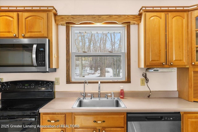 kitchen featuring stainless steel appliances and sink