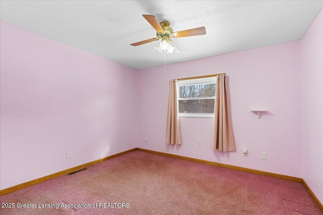 carpeted empty room with ceiling fan