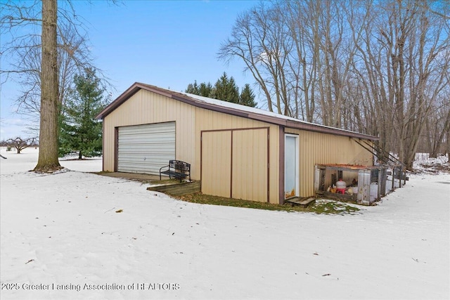 view of snow covered garage