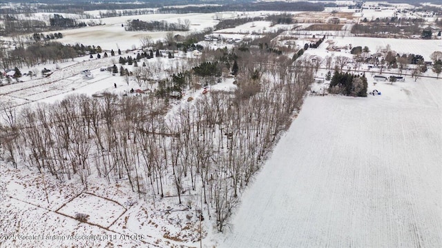 snowy aerial view featuring a rural view