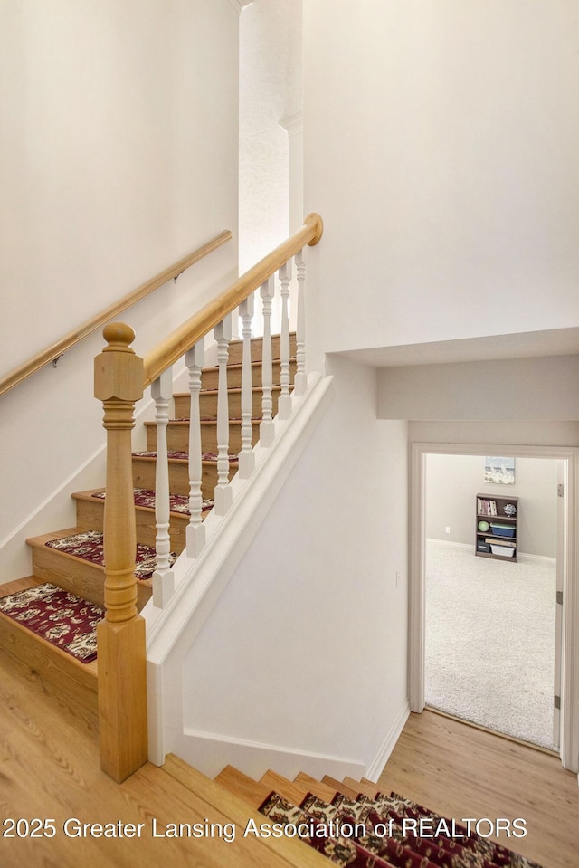 stairway featuring hardwood / wood-style flooring