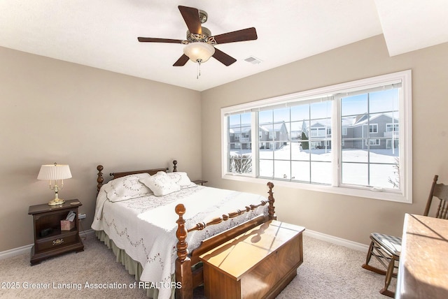 bedroom featuring ceiling fan and light carpet