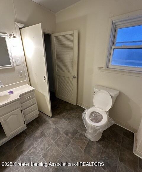 bathroom with vanity and toilet