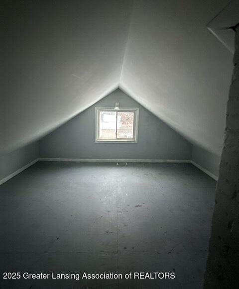 bonus room featuring lofted ceiling