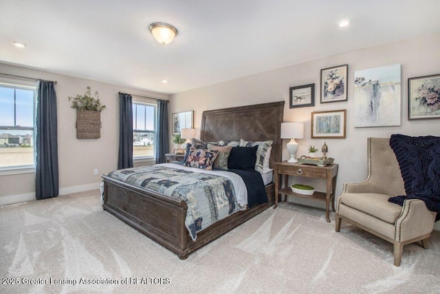 bedroom featuring light carpet, recessed lighting, and baseboards