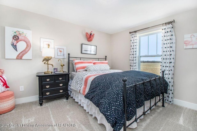 bedroom with carpet and baseboards