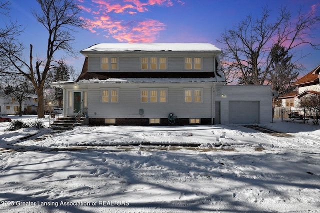 view of front of property with a garage