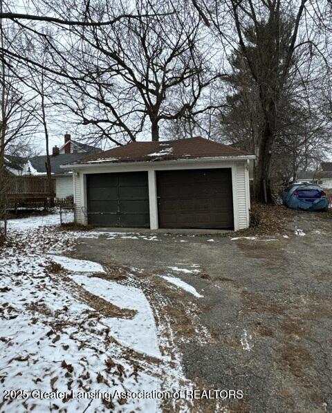 view of snow covered garage