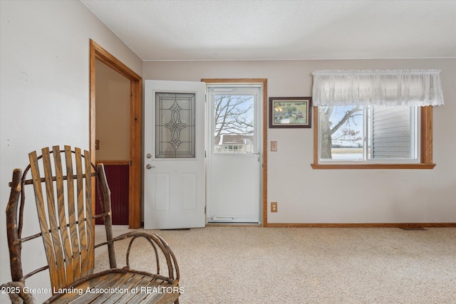 view of carpeted foyer