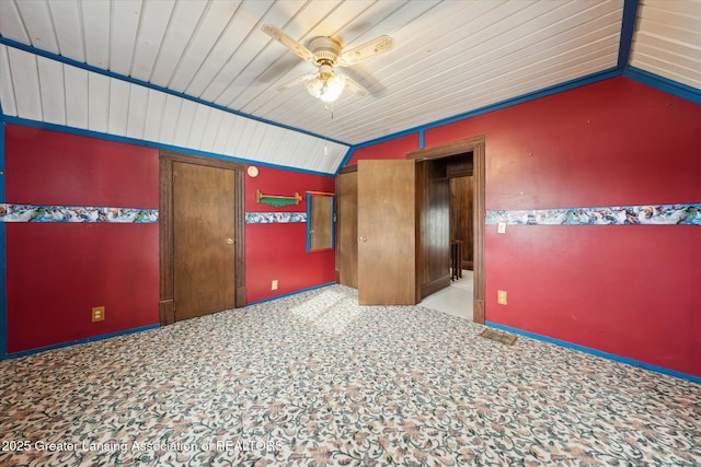 spare room with ceiling fan, vaulted ceiling, and wooden ceiling