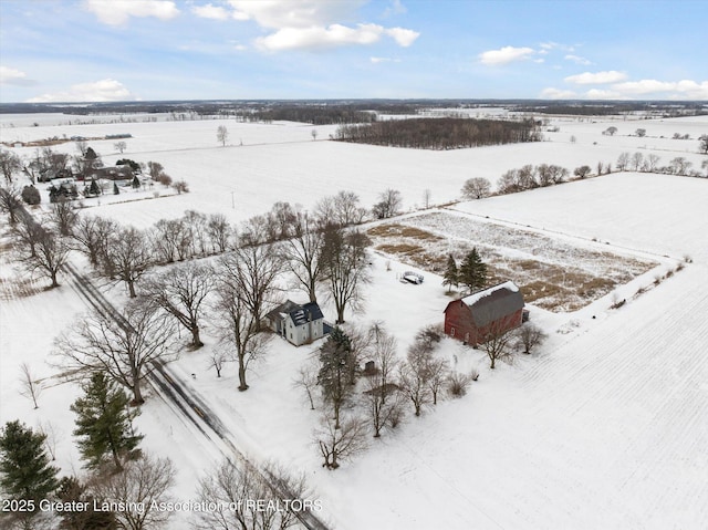 snowy aerial view featuring a rural view