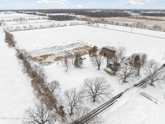 snowy aerial view featuring a rural view