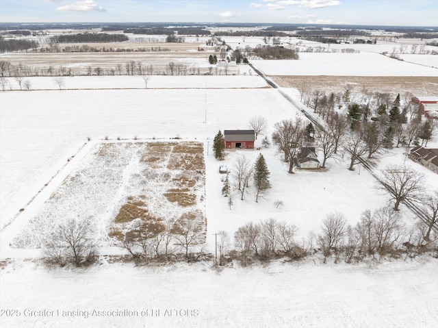 snowy aerial view with a rural view