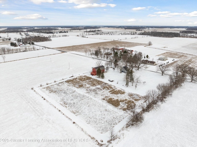 snowy aerial view featuring a rural view