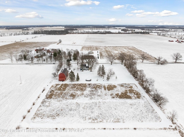 snowy aerial view featuring a rural view