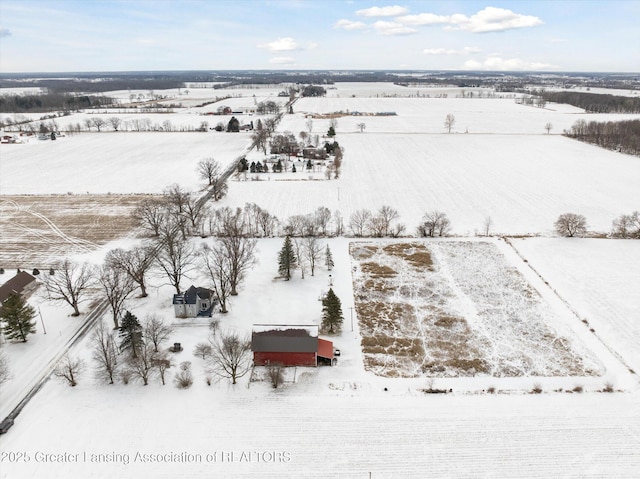 snowy aerial view with a rural view