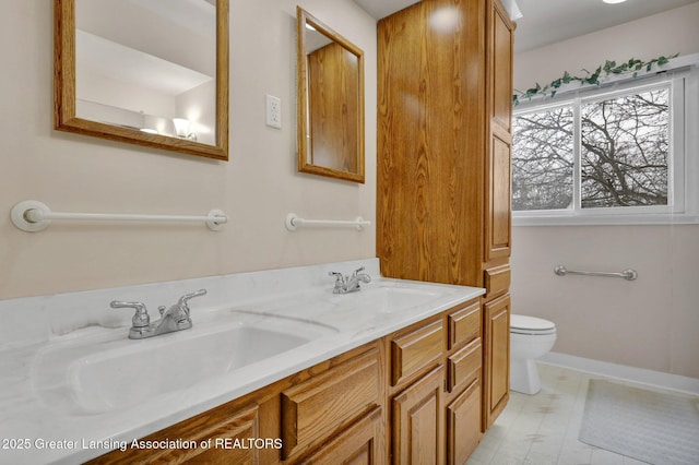 bathroom with vanity and toilet