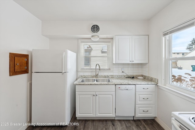 kitchen with sink, white cabinetry, dark hardwood / wood-style floors, white appliances, and decorative backsplash