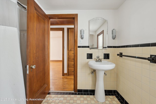 bathroom featuring tile walls and tile patterned floors