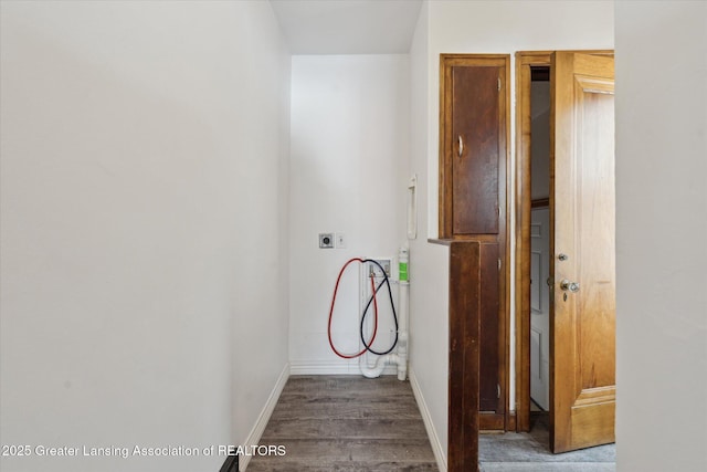 laundry room featuring dark wood-type flooring, hookup for an electric dryer, and hookup for a washing machine