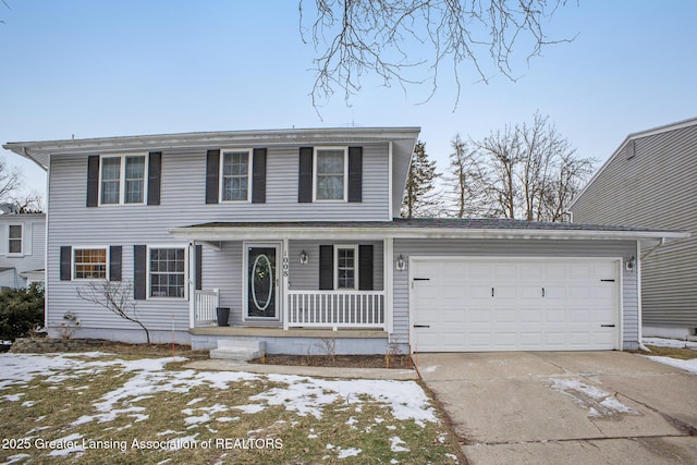 view of front of property with a garage and a porch