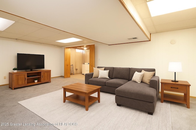 1008 Touraine Ave, East Lansing, MI 48823 - carpeted living room with a drop ceiling and baseboards