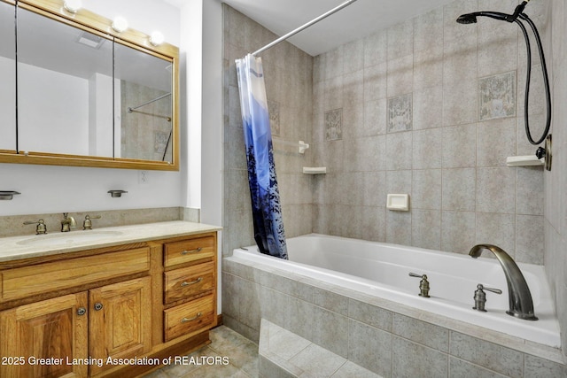 bathroom featuring tile patterned flooring, vanity, and shower / bath combo