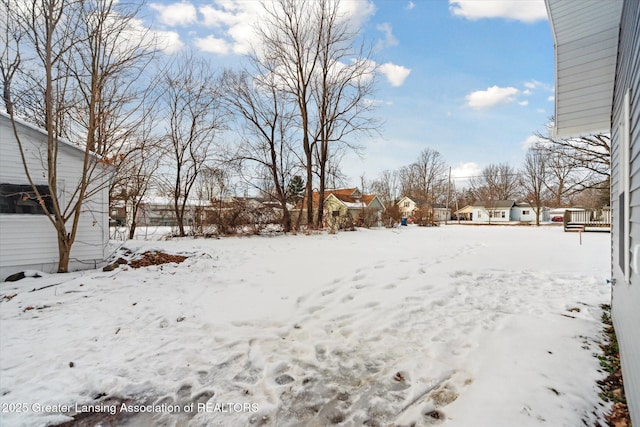 view of yard layered in snow