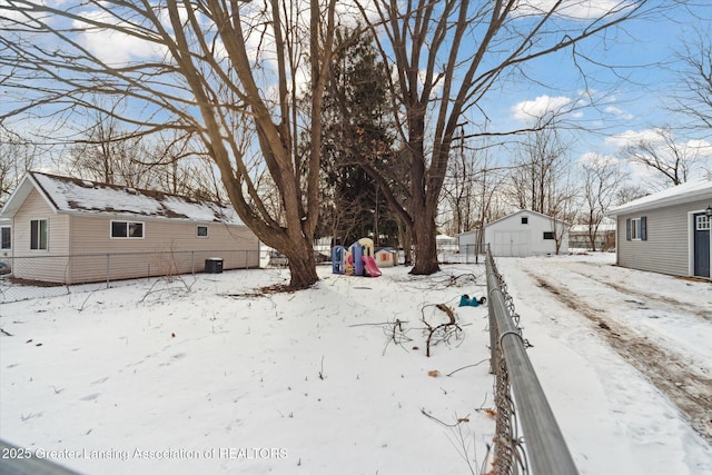 view of yard layered in snow