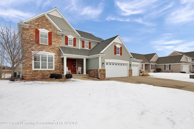 craftsman-style house with a garage and central AC unit