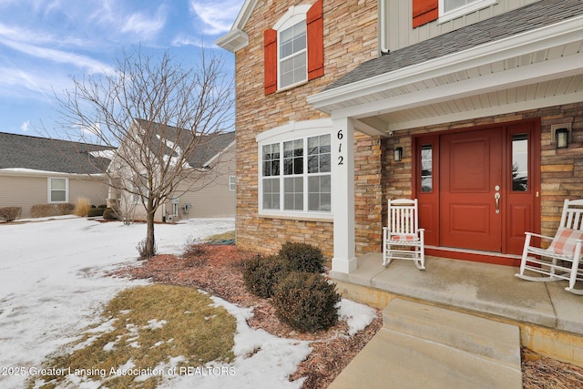 view of snow covered property entrance