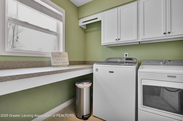 laundry room featuring cabinets and separate washer and dryer