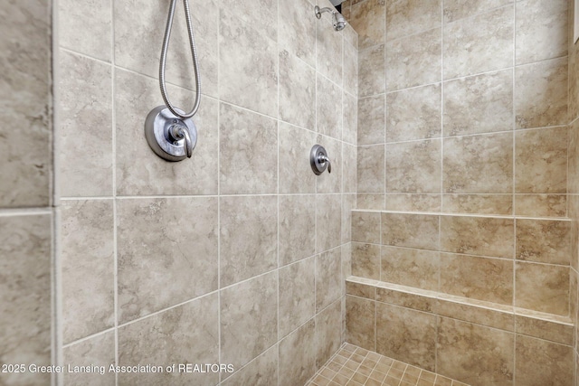 bathroom with tiled shower