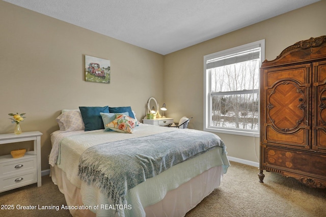 carpeted bedroom with a textured ceiling