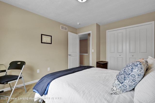 carpeted bedroom with a closet