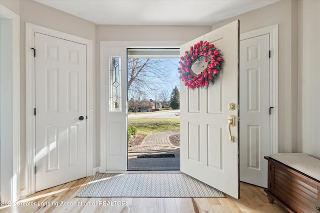 foyer entrance featuring light wood-style floors