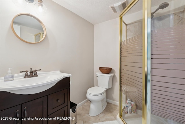 full bathroom featuring visible vents, toilet, a stall shower, a textured ceiling, and vanity