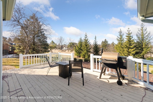 deck featuring a grill