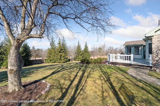 view of yard with a wooden deck