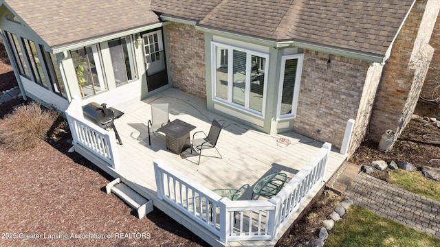 wooden terrace with a sunroom