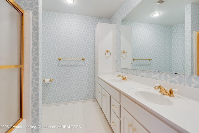 bathroom with vanity and an enclosed shower