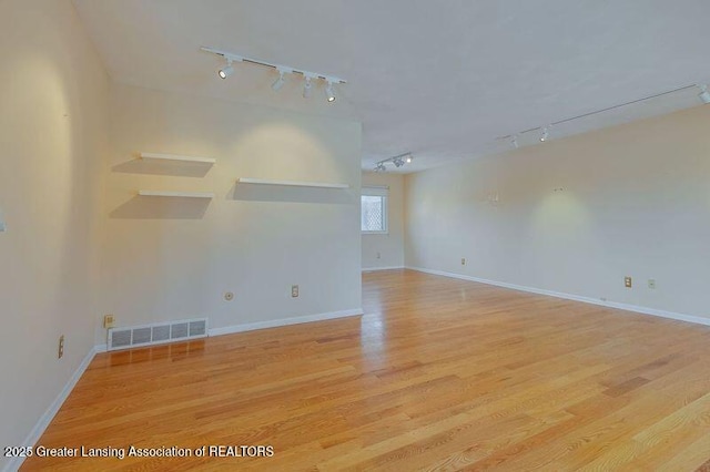 unfurnished room featuring light hardwood / wood-style floors