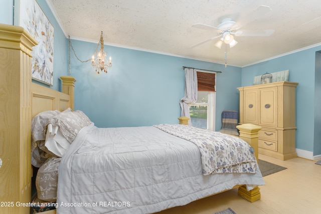 bedroom with baseboards, ornamental molding, wood finished floors, a textured ceiling, and ceiling fan with notable chandelier