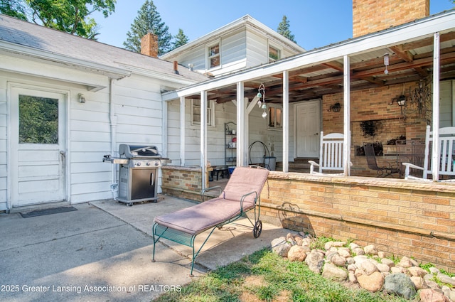 view of patio with a grill