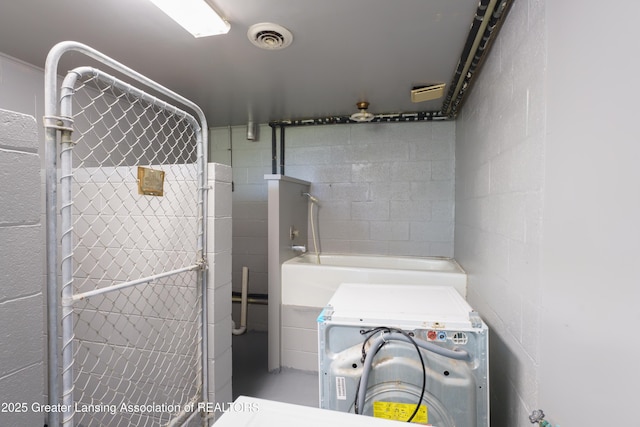 full bath featuring washer / dryer and visible vents