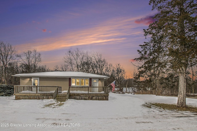 view of front of property with a wooden deck